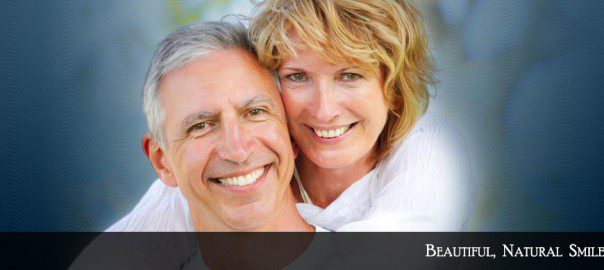 A man and woman smiling for the camera.