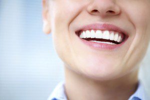 Smiling woman with bright, white teeth.